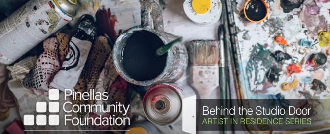 A studio in chaos with many paints