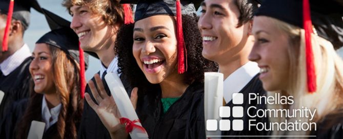 College graduates smiling because they received scholarships