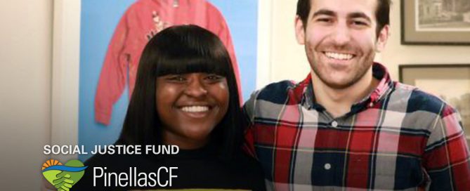 DaJuh Sawyer of the Make It Out Foundation accepts a grant from PCF Grant Manager David Bender.