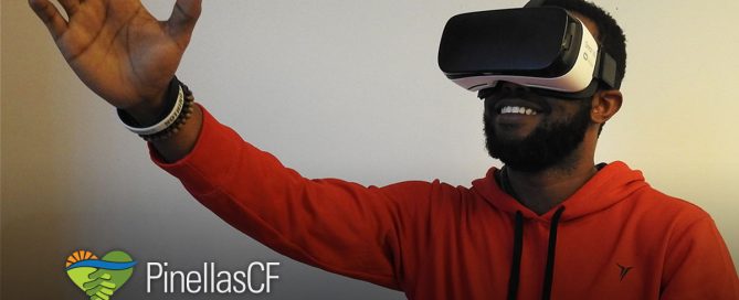 Young man uses Virtual Reality headset