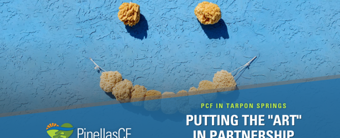 A smiley face made from natural sponges hangs on a wall at the Tarpon Springs Sponge Docks.