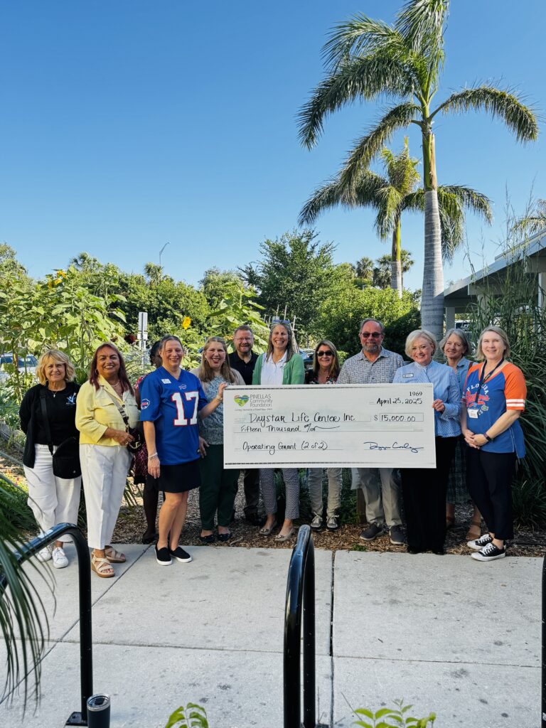Daystar Life Center staff posing with Pinellas Community Foundation and a check presentation for an operating grant