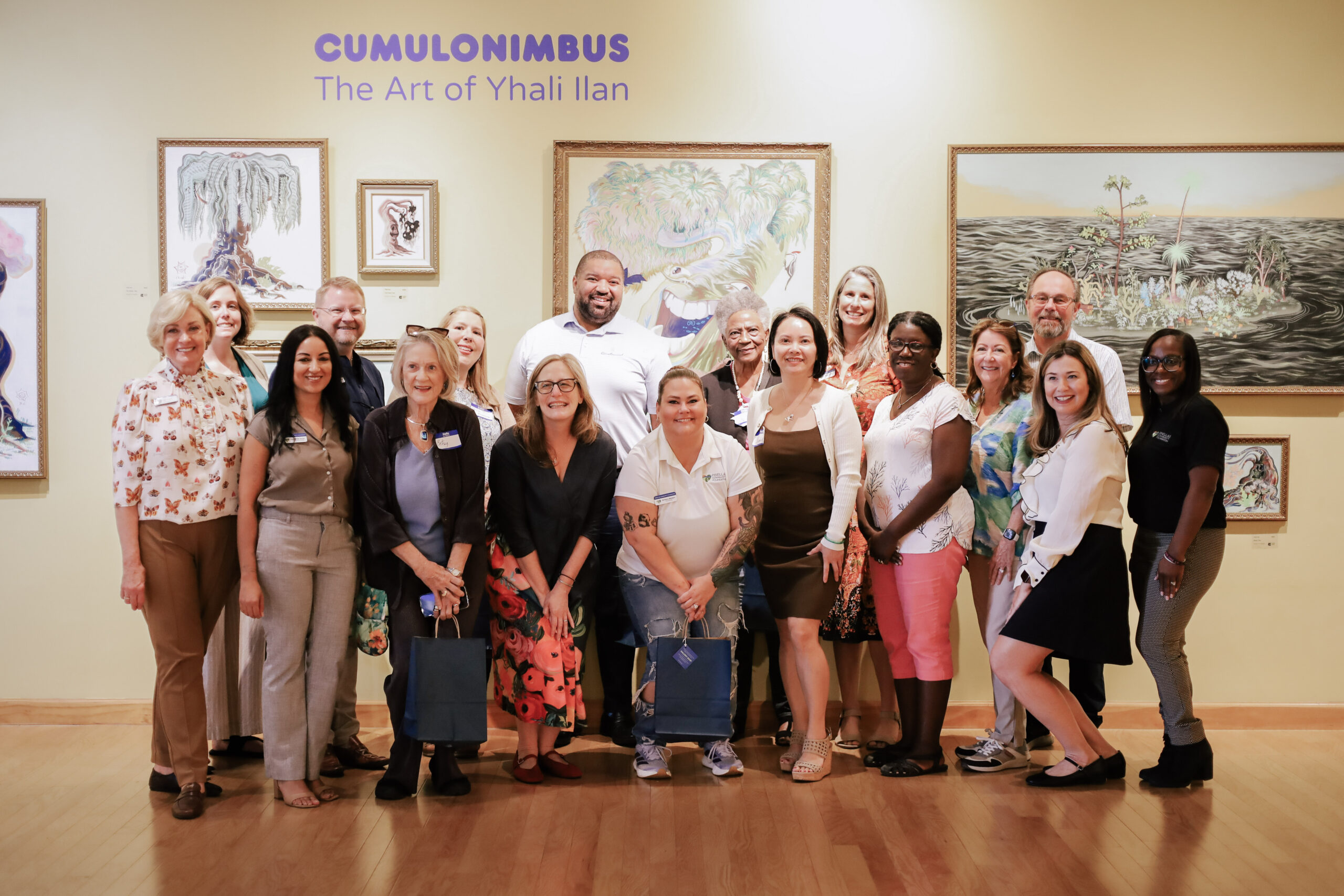 Dunedin Fine Art: Teaching artist guides learners in a bright studio with works-in-progress on easels.