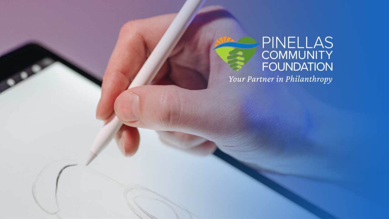 hand holding an apple pencil creating art on tablet