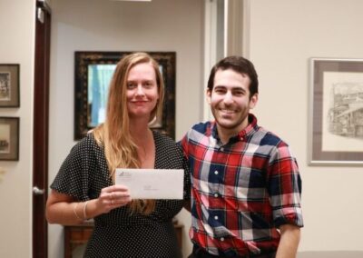 Maureen McDale of Keep St. Pete Lit accepts a grant from PCF Grant Manager David Bender.
